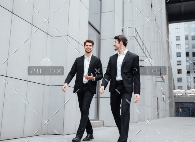 demo-attachment-922-two-businessmen-walking-and-talking-in-the-city-PMW8E26